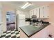 Bright kitchen featuring stainless steel appliances and checkered flooring at 2867 Holly Oaks Dr, Marietta, GA 30062