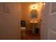 Charming powder room featuring a pedestal sink and decorative mirror, perfect for guests and convenience at 3071 Intrepid Wake, Marietta, GA 30062