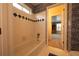 Bathroom with a blue patterned accent wall above a white tiled bathtub with a window at 3071 Intrepid Wake, Marietta, GA 30062