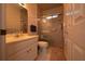 Compact bathroom features a glass-enclosed shower and a vanity with storage, maximizing functionality in a small space at 3071 Intrepid Wake, Marietta, GA 30062