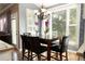 Cozy breakfast nook bathed in natural light, featuring a stylish chandelier and seating for casual dining at 3071 Intrepid Wake, Marietta, GA 30062