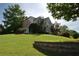 Two-story home with brick accents on a lush green, landscaped hill at 3071 Intrepid Wake, Marietta, GA 30062
