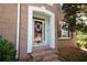 Charming front door with a floral wreath and brick steps at 3071 Intrepid Wake, Marietta, GA 30062