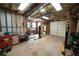Spacious garage featuring work bench, storage, and car lift at 3071 Intrepid Wake, Marietta, GA 30062