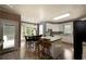 Bright kitchen features a dining table, granite counters, modern appliances, a kitchen island, and access to outdoor living spaces at 3071 Intrepid Wake, Marietta, GA 30062