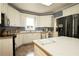 Bright kitchen with ample counter space, white cabinetry, and modern stainless steel appliances for a delightful cooking experience at 3071 Intrepid Wake, Marietta, GA 30062