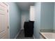 Compact laundry area featuring a modern washing machine and storage, perfect for efficient home management at 3071 Intrepid Wake, Marietta, GA 30062