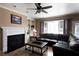 Charming living room with a cozy fireplace, complementing built-in storage and natural light from large windows at 3071 Intrepid Wake, Marietta, GA 30062