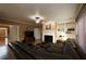 Comfortable living room boasts a classic fireplace, a large window, and well-placed built-in shelving at 3071 Intrepid Wake, Marietta, GA 30062