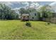 Expansive backyard features a large lawn, a wooden deck and a privacy fence at 4728 Garden Hills Dr, Stone Mountain, GA 30083