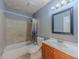 Bathroom with a tiled shower, vanity, and toilet at 4728 Garden Hills Dr, Stone Mountain, GA 30083