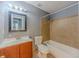Bathroom with a tiled shower, vanity, and toilet at 4728 Garden Hills Dr, Stone Mountain, GA 30083