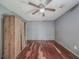 Bedroom with hardwood floors and a ceiling fan at 4728 Garden Hills Dr, Stone Mountain, GA 30083