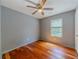 Bedroom with hardwood floors, a ceiling fan, and a window at 4728 Garden Hills Dr, Stone Mountain, GA 30083