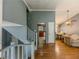 Inviting entryway featuring hardwood floors, stairs to the upper level, and open access to the kitchen at 4728 Garden Hills Dr, Stone Mountain, GA 30083