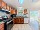 Cozy kitchen with wooden cabinets, granite countertops, and open access to a sliding door at 4728 Garden Hills Dr, Stone Mountain, GA 30083