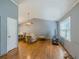 Comfortable living room with hardwood floors, vaulted ceiling, and bright natural light at 4728 Garden Hills Dr, Stone Mountain, GA 30083