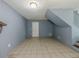 Open living room featuring tile flooring, light-colored paint, and doorways at 4728 Garden Hills Dr, Stone Mountain, GA 30083