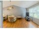 Inviting living room featuring hardwood floors, vaulted ceiling, and a cozy chair at 4728 Garden Hills Dr, Stone Mountain, GA 30083