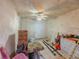 Messy room with a ceiling fan and a closed door at 4728 Garden Hills Dr, Stone Mountain, GA 30083