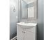 Clean half bath with single vanity and modern sink at 1220 Roswell Manor Cir, Roswell, GA 30076