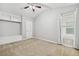 Bedroom featuring neutral colors, carpet, a built-in shelf, and a window at 1220 Roswell Manor Cir, Roswell, GA 30076