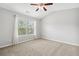 Bedroom features carpet, neutral colors, and a ceiling fan at 1220 Roswell Manor Cir, Roswell, GA 30076