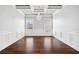 A dining room with hardwood flooring, coffered ceilings, and modern chandelier at 1220 Roswell Manor Cir, Roswell, GA 30076