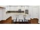 Modern kitchen with granite countertops, stainless steel appliances, and a breakfast bar with seating at 1220 Roswell Manor Cir, Roswell, GA 30076