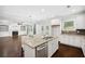Kitchen features white cabinets, granite countertops, stainless appliances, and a view into the living room at 1220 Roswell Manor Cir, Roswell, GA 30076