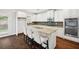 Modern kitchen with granite countertops, stainless steel appliances, and a breakfast bar with seating at 1220 Roswell Manor Cir, Roswell, GA 30076