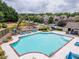 Community pool and playground with ample seating and lounging options on a sunny day at 1220 Roswell Manor Cir, Roswell, GA 30076