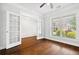 A bright bonus room with hardwood flooring and white French doors at 1220 Roswell Manor Cir, Roswell, GA 30076