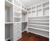 Custom closet with built-in shelving and drawers, ideal for organization and storage at 1220 Roswell Manor Cir, Roswell, GA 30076
