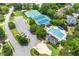 An aerial view showcasing the community's amenities: pool, tennis courts, and well-maintained landscaping at 1995 Settindown Dr, Roswell, GA 30075