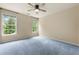 Comfortable bedroom with fresh carpet and two windows for natural lighting at 1995 Settindown Dr, Roswell, GA 30075