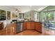 Well-lit kitchen island flows into living and breakfast areas, great for entertaining at 1995 Settindown Dr, Roswell, GA 30075