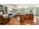 Inviting living area with hardwood floors, fireplace, built-in shelves, and ample natural light at 1995 Settindown Dr, Roswell, GA 30075