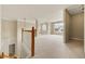 Upstairs loft area featuring fresh carpet, white trim, and natural lighting at 1995 Settindown Dr, Roswell, GA 30075