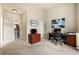 Functional office featuring neutral walls, carpet, and a view to an ensuite powder room at 1995 Settindown Dr, Roswell, GA 30075