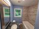Updated bathroom with granite vanity, tiled shower, and modern fixtures, creating a relaxing spa-like experience at 2217 Sargent Se Pl, Atlanta, GA 30315