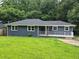 Charming single-story home with freshly painted blue exterior, new roof, and a well-manicured lawn at 2217 Sargent Se Pl, Atlanta, GA 30315