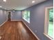 Spacious living room with hardwood floors, recessed lighting, and large windows offering ample natural light at 2217 Sargent Se Pl, Atlanta, GA 30315