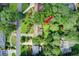 Aerial view showcases a lovely home surrounded by mature trees on a beautifully landscaped lot at 2440 Weatherford Ct, Marietta, GA 30068