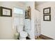 Cozy bathroom featuring a walk-in shower and a window with shuttered blinds at 2440 Weatherford Ct, Marietta, GA 30068