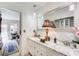 Bright bathroom with marble countertops, a large mirror and elegant fixtures at 2440 Weatherford Ct, Marietta, GA 30068