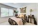 Comfortable bedroom with a plush bed, decorative pillows, and a window providing natural light at 2440 Weatherford Ct, Marietta, GA 30068