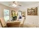 Charming dining area with a glass-top table and upholstered chairs, perfect for intimate gatherings and meals at 2440 Weatherford Ct, Marietta, GA 30068