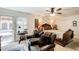 Comfortable main bedroom with an upholstered bed, ceiling fan, and patio access at 2440 Weatherford Ct, Marietta, GA 30068