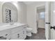 Clean bathroom with a white vanity, a large mirror, and tiled floors at 33 Russell Rd, Mcdonough, GA 30252